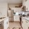 a kitchen with white cabinets