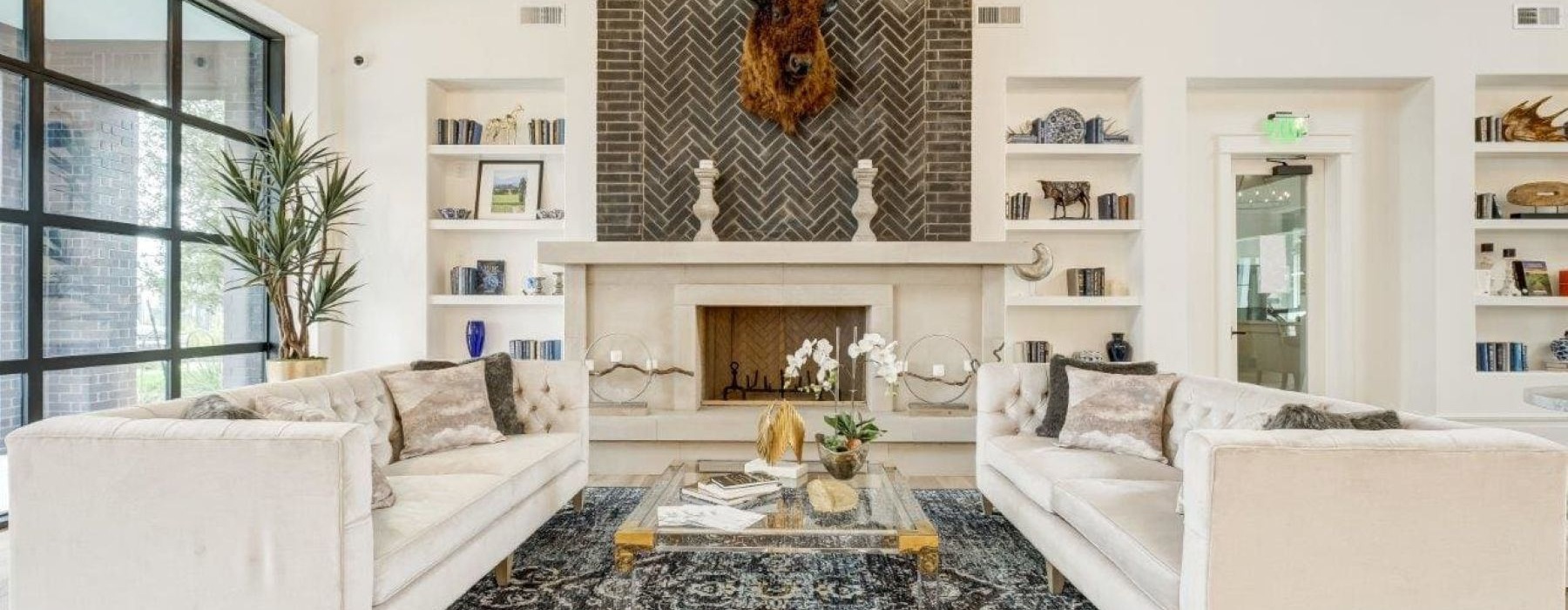 a clubhouse room with a fireplace