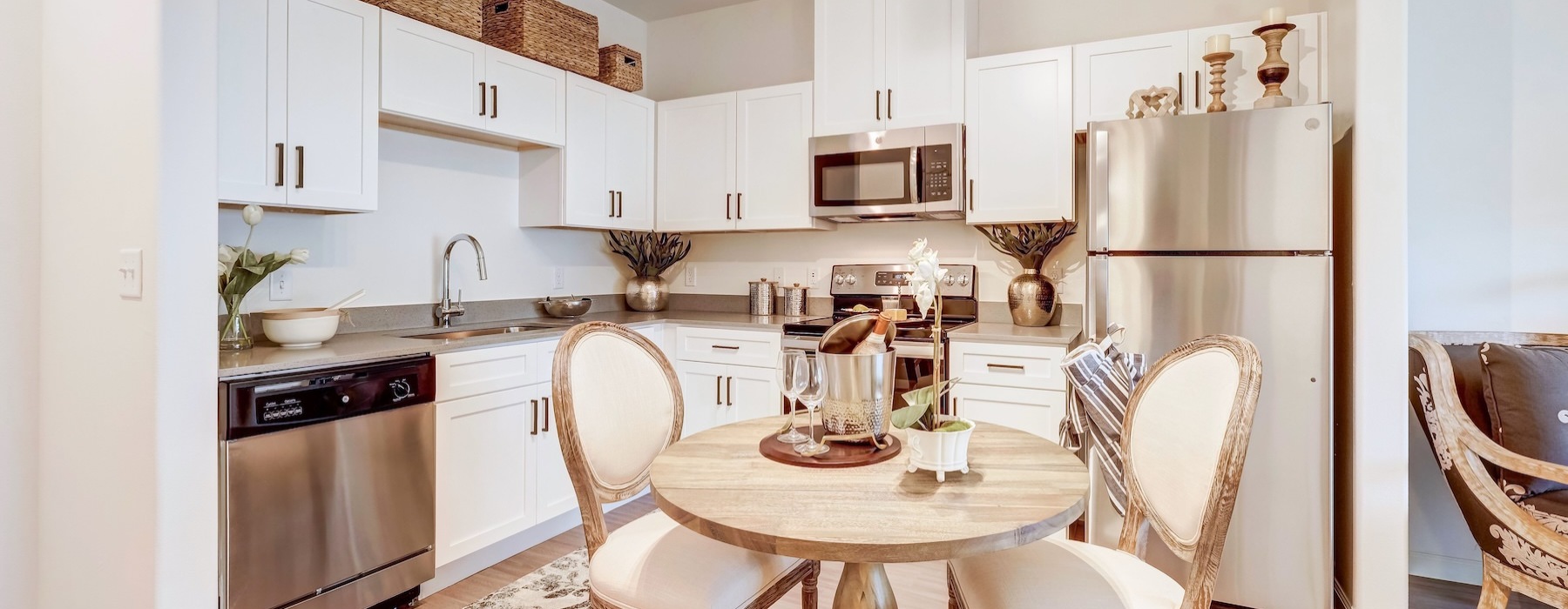 a kitchen with white cabinets