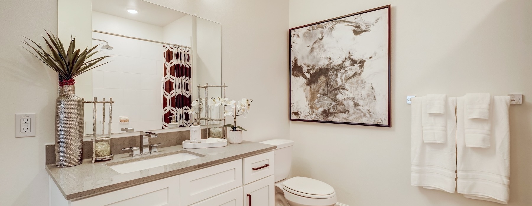 a bathroom with a large mirror