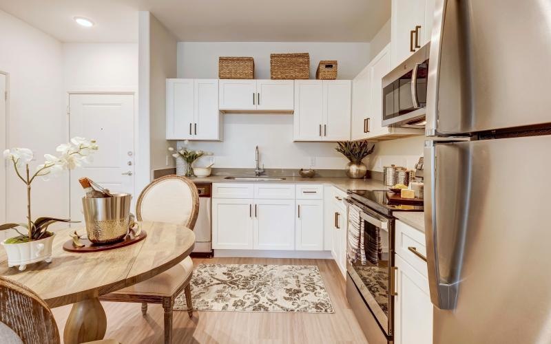 a kitchen with a table and chairs