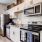 a kitchen with white cabinets