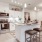 a kitchen with a bar stool and a bar stool