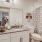 a bathroom with a tub sink and toilet